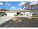 Charming single-story home with manicured lawn, an arched entryway, and attached two-car garage at 2603 Royal Ridge Dr, Spring Hill, FL 34606