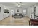 Spacious living room with sleek floors, comfy seating, and a chic wet bar for entertaining at 2603 Royal Ridge Dr, Spring Hill, FL 34606