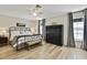Inviting main bedroom featuring a black wardrobe and ample natural light from large windows at 2603 Royal Ridge Dr, Spring Hill, FL 34606