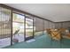 Relaxing screened porch with patio access and ample seating at 2603 Royal Ridge Dr, Spring Hill, FL 34606