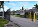 Gated community entrance with well-maintained landscaping at 2993 Breezy Meadows Dr, Clearwater, FL 33760