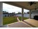 Covered patio overlooking the backyard at 2993 Breezy Meadows Dr, Clearwater, FL 33760