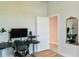 Modern home office with standing desk and large monitor at 2993 Breezy Meadows Dr, Clearwater, FL 33760