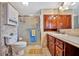 Clean bathroom with wood cabinets and shower stall at 322 S Port Royal Ln, Apollo Beach, FL 33572