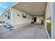 Covered carport with storage area and bench at 322 S Port Royal Ln, Apollo Beach, FL 33572