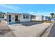 Charming single-wide mobile home with carport and landscaped yard at 322 S Port Royal Ln, Apollo Beach, FL 33572