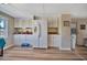 Kitchen boasts white cabinets, refrigerator, and access to the backyard at 322 S Port Royal Ln, Apollo Beach, FL 33572