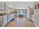 Well-lit kitchen with white cabinets and modern appliances at 322 S Port Royal Ln, Apollo Beach, FL 33572