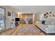 Living room with light walls, wood-look floors, and stylish seating at 322 S Port Royal Ln, Apollo Beach, FL 33572