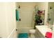 Clean bathroom with shower/tub combo, and a storage rack at 33010 Major Oak Dr, Wesley Chapel, FL 33545