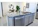 Modern kitchen island with granite countertop and stainless steel dishwasher at 33010 Major Oak Dr, Wesley Chapel, FL 33545