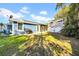 Backyard with grassy area, patio, and grill at 3621 19Th Street N, St Petersburg, FL 33713