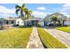 Cute bungalow style home with a brick paver driveway and well-manicured lawn at 3621 19Th Street N, St Petersburg, FL 33713