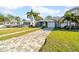 Charming house with a brick paver driveway and lush green lawn at 3621 19Th Street N, St Petersburg, FL 33713