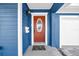 Inviting orange front door with glass accents and a stylish hello mat at 3621 19Th Street N, St Petersburg, FL 33713
