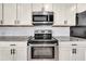 Stainless steel appliances and granite countertops in this updated kitchen at 3621 19Th Street N, St Petersburg, FL 33713
