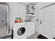 Laundry room with washer, dryer, and storage shelf at 3621 19Th Street N, St Petersburg, FL 33713
