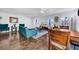 Spacious living area with hardwood floors, teal furniture, and dining area at 3621 19Th Street N, St Petersburg, FL 33713