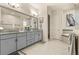 Elegant bathroom with double vanity, granite countertops, and a soaking tub at 4041 Woodland Retreat Blvd, New Port Richey, FL 34655