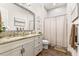 Clean bathroom with single vanity and shower/tub combo at 4041 Woodland Retreat Blvd, New Port Richey, FL 34655