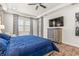 Spacious bedroom with a large bed, dresser, and window coverings at 4041 Woodland Retreat Blvd, New Port Richey, FL 34655