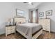 Bright bedroom with a queen bed and a neutral color scheme at 4041 Woodland Retreat Blvd, New Port Richey, FL 34655