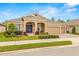 Luxury home with three-car garage and well-manicured landscaping at 4041 Woodland Retreat Blvd, New Port Richey, FL 34655