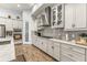 Modern kitchen with grey cabinets, granite countertops, and stainless steel appliances at 4041 Woodland Retreat Blvd, New Port Richey, FL 34655