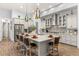 Spacious kitchen with an island, granite countertops and modern light fixtures at 4041 Woodland Retreat Blvd, New Port Richey, FL 34655