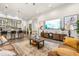 Living room with leather sofas and large TV at 4041 Woodland Retreat Blvd, New Port Richey, FL 34655
