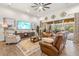 Spacious living room with comfortable seating and large TV at 4041 Woodland Retreat Blvd, New Port Richey, FL 34655