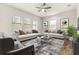 Spacious living room featuring a neutral color palette and ample natural light at 4041 Woodland Retreat Blvd, New Port Richey, FL 34655