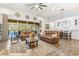 Open living space featuring leather furniture and pool view at 4041 Woodland Retreat Blvd, New Port Richey, FL 34655