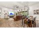 Living area with a large TV and access to backyard at 4041 Woodland Retreat Blvd, New Port Richey, FL 34655