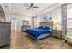 Spacious main bedroom with king-size bed and ensuite bath at 4041 Woodland Retreat Blvd, New Port Richey, FL 34655