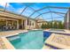 Relaxing screened pool and spa with paver deck at 4041 Woodland Retreat Blvd, New Port Richey, FL 34655