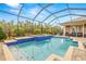 Large screened pool and spa with paver deck at 4041 Woodland Retreat Blvd, New Port Richey, FL 34655
