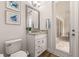 Convenient powder room with single vanity and access to the patio at 4041 Woodland Retreat Blvd, New Port Richey, FL 34655