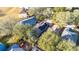 Aerial view of house featuring solar panels and a backyard pool at 410 Pine Pointe Ct, Seffner, FL 33584