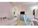 Charming bedroom with pink walls and a comfy bed at 410 Pine Pointe Ct, Seffner, FL 33584
