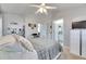 Comfortable bedroom with ensuite bathroom and ample natural light at 410 Pine Pointe Ct, Seffner, FL 33584