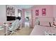 Cozy bedroom with a desk and Hello Kitty wall art at 410 Pine Pointe Ct, Seffner, FL 33584