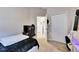Cozy bedroom with a bed and access to the hallway at 410 Pine Pointe Ct, Seffner, FL 33584