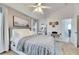 Well-lit bedroom featuring a cozy bed and modern decor at 410 Pine Pointe Ct, Seffner, FL 33584