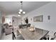 Dining room features a view into living room and kitchen at 410 Pine Pointe Ct, Seffner, FL 33584