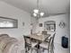Dining area with a square table and four chairs and a pass-through at 410 Pine Pointe Ct, Seffner, FL 33584