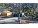 Single-story house with gray garage door and well-maintained front yard at 410 Pine Pointe Ct, Seffner, FL 33584