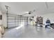 Two-car garage with storage shelving and opener at 410 Pine Pointe Ct, Seffner, FL 33584