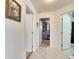 Bright hallway with tile flooring and access to bedrooms at 410 Pine Pointe Ct, Seffner, FL 33584