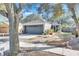 One-story house with gray garage door and nicely landscaped yard at 410 Pine Pointe Ct, Seffner, FL 33584